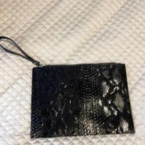Black wrist bag snakeskin like new.